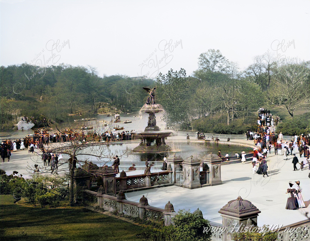 A small crowd gathers near Bethesda Fountain to enjoy pleasant weather and boat rides on the lake.