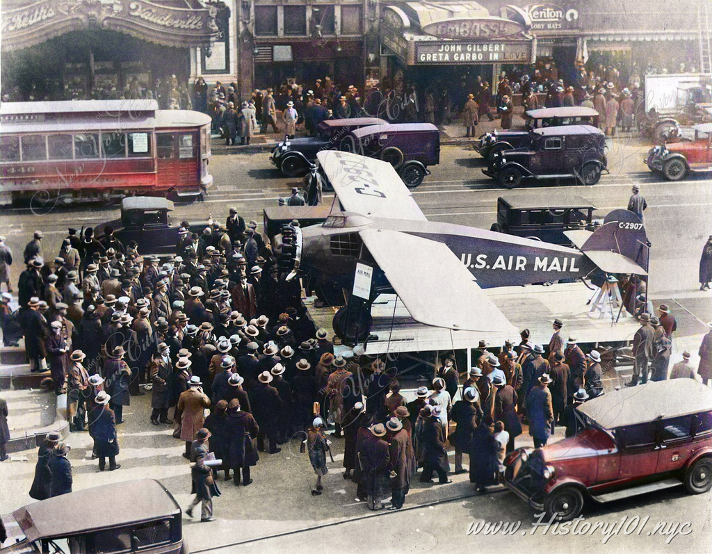 Explore the 1927 Times Square Air Mail plane display, a key moment in NYC's history, highlighting advancements in aviation and mail service
