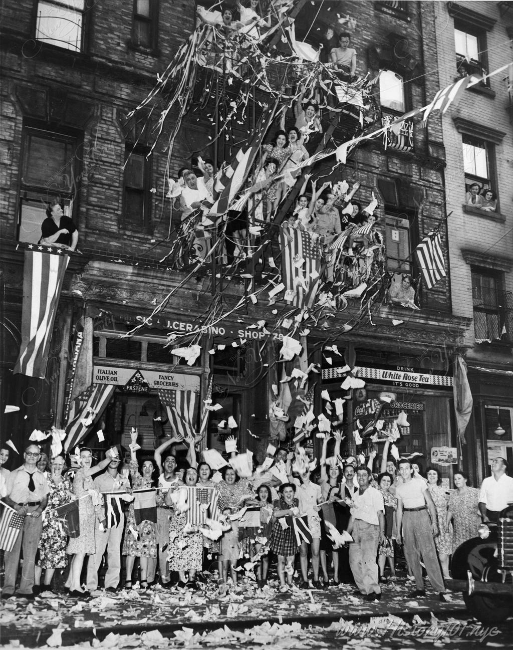 Residents of New York's "Little Italy" in front of 78 Mulberry Street greet the news of Japan's acceptance of Allied surrender