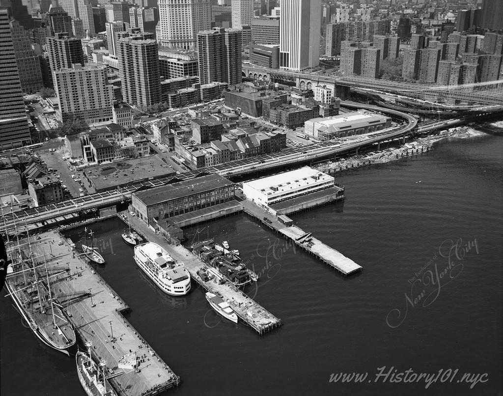 Aerial view of the East River showing Piers 17 and 18, South Street Seaport at Fulton Street.