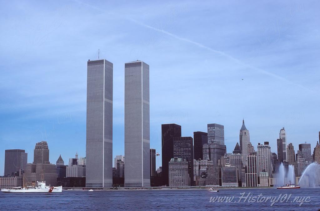 Photograph of Lower Manhattan's iconic skyline with the Twin Towers featured prominently.
