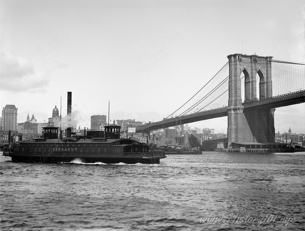Photograph of the Fulton Ferry crossing the East River with the Brooklyn Bridge in the background.